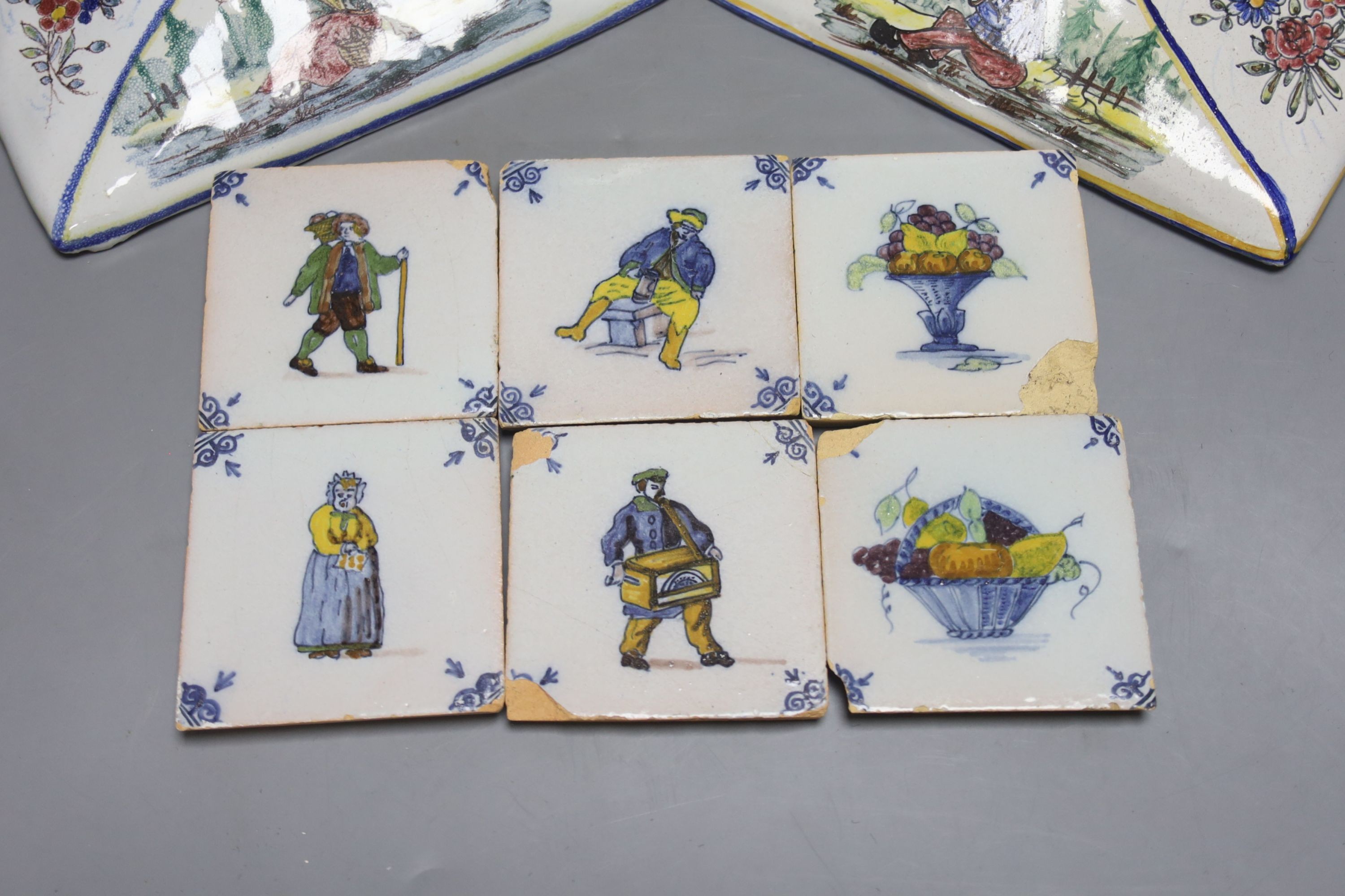 A pair of Delft wall brackets, a set of six delft small tiles and a large maiolica pitcher, height 30cm